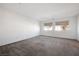 Spacious bedroom with carpet and two windows at 1722 Game Garden Rd, North Las Vegas, NV 89031