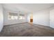 Bright bedroom featuring neutral walls and carpet, plus an ensuite bathroom at 1722 Game Garden Rd, North Las Vegas, NV 89031