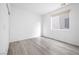 Bright bedroom with large window and gray flooring at 1722 Game Garden Rd, North Las Vegas, NV 89031