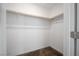 Walk-in closet with wood shelving at 1722 Game Garden Rd, North Las Vegas, NV 89031