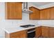 Kitchen detail showing gas cooktop and range hood at 1722 Game Garden Rd, North Las Vegas, NV 89031