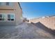 Narrow side yard with block wall and gravel at 1722 Game Garden Rd, North Las Vegas, NV 89031