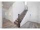 Modern staircase with dark gray railing and carpeted steps at 1722 Game Garden Rd, North Las Vegas, NV 89031