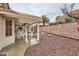 Backyard featuring a covered patio, pergola and low maintenance desert landscaping at 3005 Noblesville Ct, Henderson, NV 89052