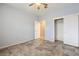 Bedroom with tile floors, light grey walls and a large closet with sliding doors at 3005 Noblesville Ct, Henderson, NV 89052