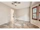 Bedroom featuring natural light from window, neutral paint, a ceiling fan and tile flooring at 3005 Noblesville Ct, Henderson, NV 89052