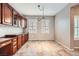 Dining area with built-in cabinets, neutral paint, and lots of natural light from shuttered windows at 3005 Noblesville Ct, Henderson, NV 89052