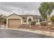 Charming single-story home featuring a tile roof, two-car garage and low maintenance landscaping at 3005 Noblesville Ct, Henderson, NV 89052