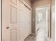 Hallway view to laundry area with washer and dryer and closet with sliding doors at 3005 Noblesville Ct, Henderson, NV 89052