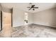 Open-concept living room with tile flooring and neutral paint, creating a bright and airy space at 3005 Noblesville Ct, Henderson, NV 89052