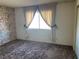 Cozy bedroom with neutral walls and carpet at 427 E Barrett St, Henderson, NV 89011