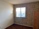 Bedroom with patterned wallpaper and window with blinds at 427 E Barrett St, Henderson, NV 89011