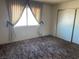 Spacious bedroom with double closets and window at 427 E Barrett St, Henderson, NV 89011