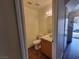 View of a half bathroom featuring a toilet, sink, and wood-look flooring at 5330 E Charleston Blvd # 5, Las Vegas, NV 89142