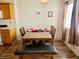 Cozy dining area adjacent to the kitchen, featuring a wooden table and a combination of chairs and bench seating at 5330 E Charleston Blvd # 5, Las Vegas, NV 89142