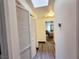 Hallway leading to bedroom features laminate floors, closet storage and neutral paint at 5330 E Charleston Blvd # 5, Las Vegas, NV 89142