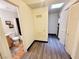 Hallway with a view into the bathroom, a closet, and wood-look flooring at 5330 E Charleston Blvd # 5, Las Vegas, NV 89142