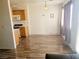 Bright kitchen and dining area with laminate wood flooring and ample natural light from sliding glass doors at 5330 E Charleston Blvd # 5, Las Vegas, NV 89142