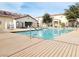 Exterior shot of a community pool with clear blue water, surrounded by lounge chairs and buildings at 5330 E Charleston Blvd # 5, Las Vegas, NV 89142