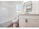 Updated bathroom with white cabinets, a new vanity, and modern fixtures at 686 Ribbon Grass Ave, Las Vegas, NV 89183