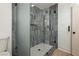 Modern bathroom with a large walk-in shower and gray tile at 686 Ribbon Grass Ave, Las Vegas, NV 89183