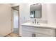 Clean bathroom with white vanity and modern fixtures at 686 Ribbon Grass Ave, Las Vegas, NV 89183