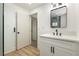 Modern bathroom with white vanity and a walk-in shower at 686 Ribbon Grass Ave, Las Vegas, NV 89183