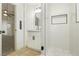 Modern bathroom with white tile, a glass shower, and a vanity at 686 Ribbon Grass Ave, Las Vegas, NV 89183