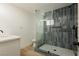 Modern bathroom with a large walk-in shower and gray tile at 686 Ribbon Grass Ave, Las Vegas, NV 89183