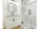 Clean bathroom with white vanity, and a glass shower at 686 Ribbon Grass Ave, Las Vegas, NV 89183