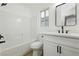 Modern bathroom featuring a white vanity, bathtub, and updated fixtures at 686 Ribbon Grass Ave, Las Vegas, NV 89183