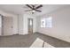 Spacious bedroom with ceiling fan and ensuite bathroom at 686 Ribbon Grass Ave, Las Vegas, NV 89183