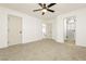 Large bedroom with ceiling fan and plush carpeting at 686 Ribbon Grass Ave, Las Vegas, NV 89183