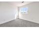 Simple bedroom with grey carpet and a window at 686 Ribbon Grass Ave, Las Vegas, NV 89183