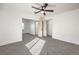 Bright bedroom with ceiling fan and grey carpeting at 686 Ribbon Grass Ave, Las Vegas, NV 89183