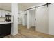 Hallway with barn door leading to kitchen at 686 Ribbon Grass Ave, Las Vegas, NV 89183