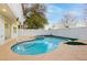 Freeform pool and spa with a large patio area at 686 Ribbon Grass Ave, Las Vegas, NV 89183