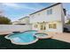 Freeform pool and spa with a large patio area at 686 Ribbon Grass Ave, Las Vegas, NV 89183