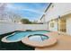 Freeform pool and spa with a large patio area at 686 Ribbon Grass Ave, Las Vegas, NV 89183