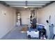 Garage with home gym setup and ample storage space at 7563 Durham Hall Ave # 101, Las Vegas, NV 89130