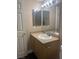 Bathroom features a vanity with double sinks and a large mirror at 8000 W Badura Ave # 2092, Las Vegas, NV 89113