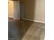 Simple carpeted bedroom with neutral walls and a door at 8000 W Badura Ave # 2092, Las Vegas, NV 89113