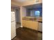 Kitchen with wood cabinetry and dark flooring at 8000 W Badura Ave # 2092, Las Vegas, NV 89113