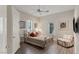 Bright bedroom with a metal bed frame, hardwood floors, and window seating at 8109 Moonstone Cir, Las Vegas, NV 89128