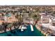 Scenic aerial view of the community lake with boat docks, recreational watercraft, and beautiful landscaping at 8109 Moonstone Cir, Las Vegas, NV 89128