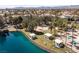 Gorgeous aerial view of the community lake and recreation area with shade structures and lush landscaping at 8109 Moonstone Cir, Las Vegas, NV 89128