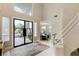 Bright entryway with modern glass door and view of dining area at 8109 Moonstone Cir, Las Vegas, NV 89128