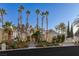 Stunning two-story home with palm trees and landscaped grounds at 8109 Moonstone Cir, Las Vegas, NV 89128