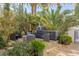 Outdoor kitchen with pizza oven and seating area at 8109 Moonstone Cir, Las Vegas, NV 89128