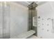 Large shower with multiple shower heads and patterned tile at 8109 Moonstone Cir, Las Vegas, NV 89128